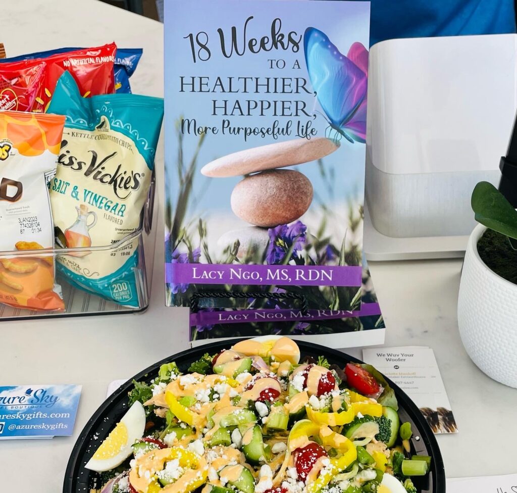"18 Weeks to a Healthier Happier, More Purposeful Life" book and a salad