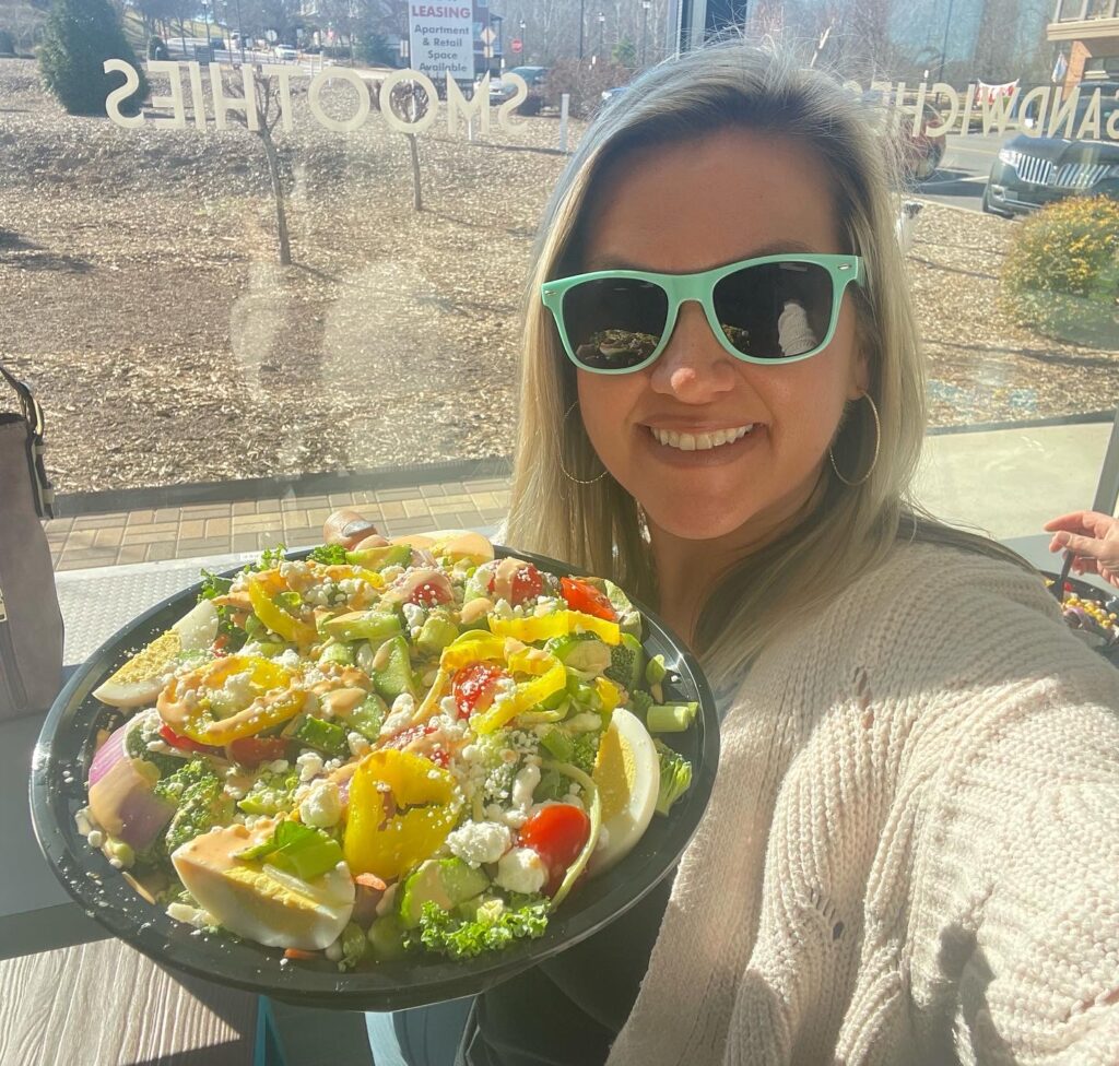 girl holding a salad from Blend Riverwalk