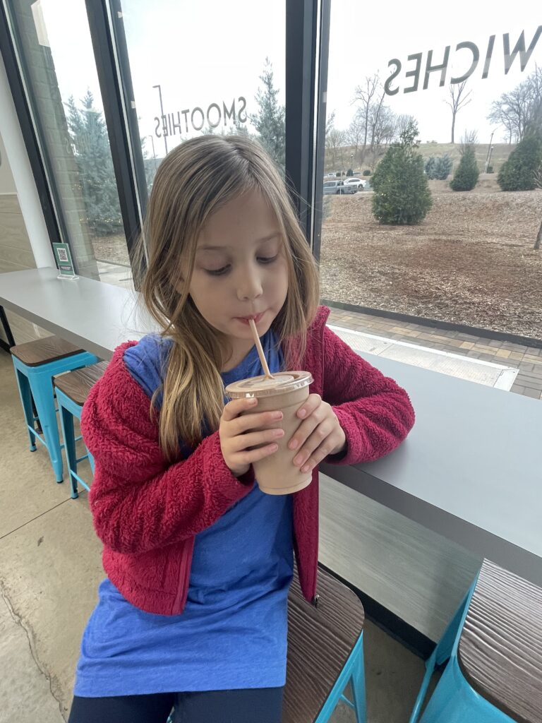 little girl drinking a smoothie at Blend Riverwalk