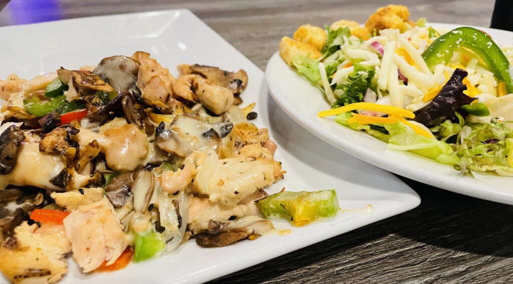 The Knife and Fork Philly Chicken and side salad at Empire Pizza Places to eat in Rock Hill, SC